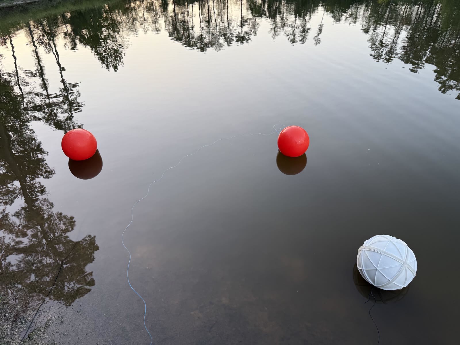 MARBLE floating near two red buoys during an obstacle collision test